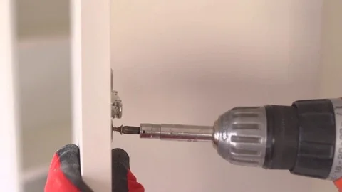 Close-up of screwdriving a drift bolt with a drill. Stock Footage 82585398