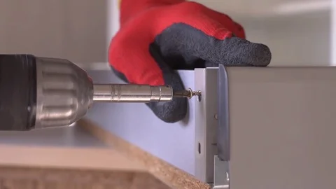 Close-up of screwdriving a drift bolt with a drill. Stock Footage 82585537