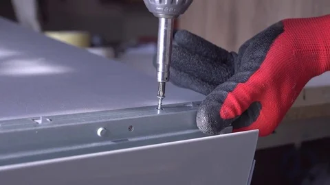 Close-up of screwdriving a drift bolt with a drill. Stock Footage 82585594