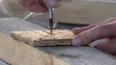 Close-up of screwing in a screw with a screwdriver 4K Stock Footage 294050707