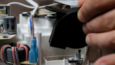 Close-up of screwing a screwdriver. Macro video recording of the process of i Stock Footage 81673283