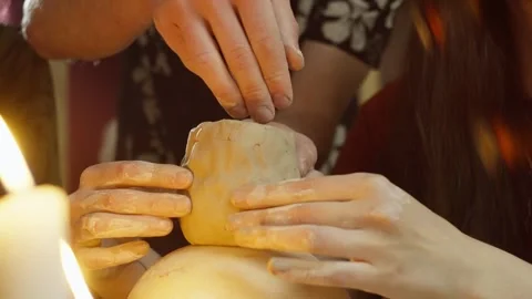 A close-up of the sculpting of a glass blank from clay. Stock Footage 252193257