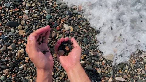 Close-up of sea pebbles in slow motion. Stock Footage 228259919