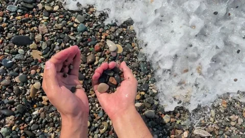 Close-up of sea pebbles in slow motion. Stock Footage 229696049