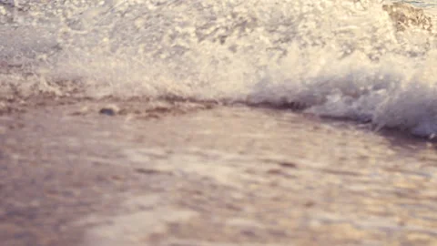 Close up of sea ripple waves washed on the beach at sunset time Stock Footage 133170285