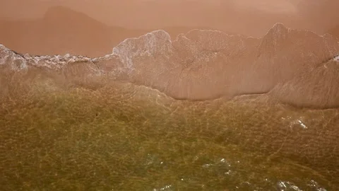 Close up sea splashing with soft waves rushing on sandy beachline Vídeo Stock 136217567