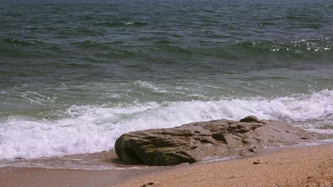 Close-up of sea stone against the background of a stormy sea Video stock 94680598
