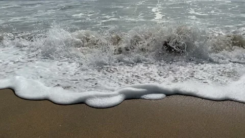 Close up sea waves and bubbles water on beach Stock Footage 164238666