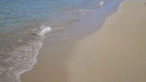 Close up of sea waves on breaking foreshore. Transparent water. Video stock 166525347