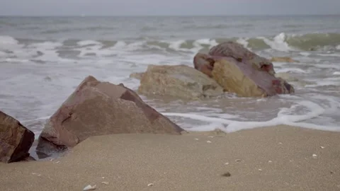 Close up sea waves breaks on rocks. Video stock 255968283