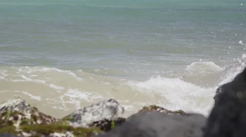 Close-up of sea waves splashing on rocks Stock Footage 50179923