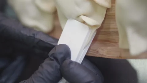 Close-up, sealing and pressing sequence in closing dough edges Stock Footage 345703489