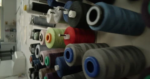 Close Up of Seamstress Taking Spool of Thread Stock Footage 316164647