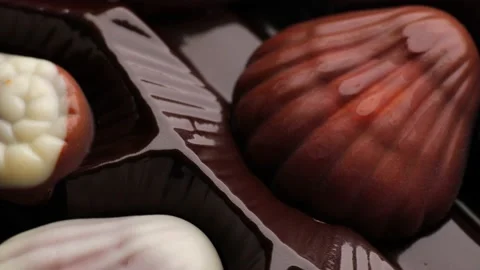 Close up of seashell chocolate, rotation in circle. seashell chocolate Stock Footage 233901175