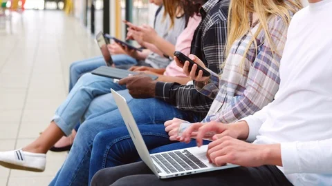 Close Up Of Seated College Students Using Digital Technology Stock Footage 86699786