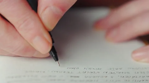 Close up secret coded writing in diary suggesting espionage hidden messages and Stock Footage 333465550
