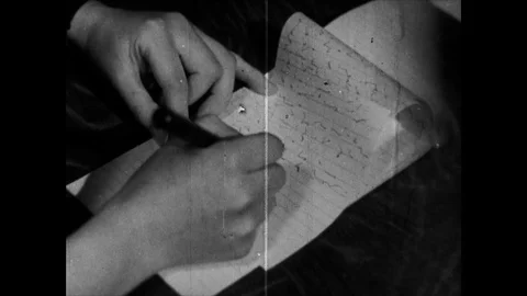 Close up of secretary writing instructions down in a paper notebook, UK 1945 Stock Footage 133384542
