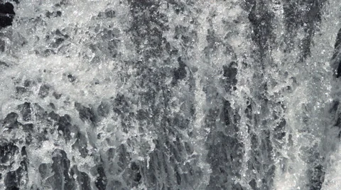 Close-up section of a foaming ultra-slow motion waterfall Stock Footage 59527755