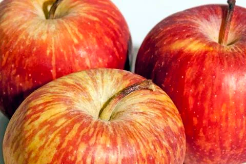 Close up Sections of Three Fresh Red Apples Stock Photos