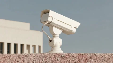 Close-up of a security camera rotating in multiple directions Video stock 315960418