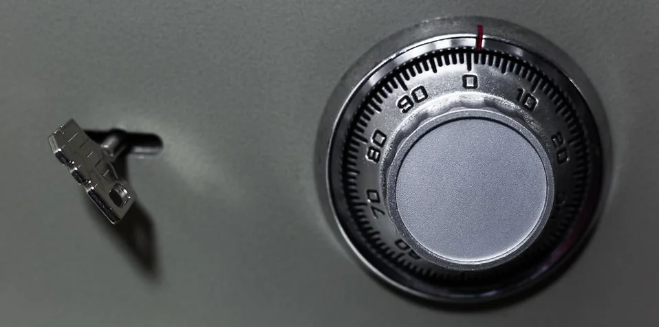 Close-up of security lock and key of safe. Stock Photos