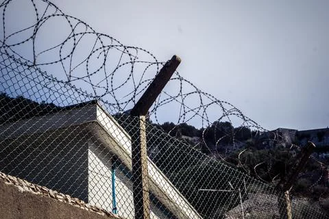 Close-up of security razor wire and barbed wire fence at historic military .. Stock Photos