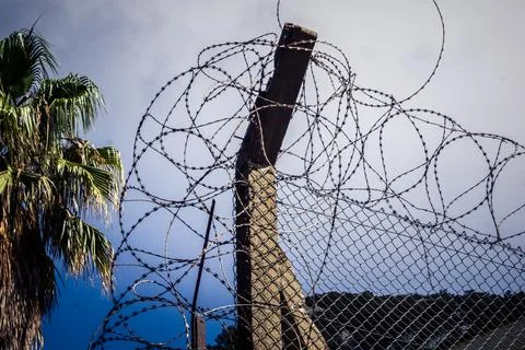 Close-up of security razor wire and barbed wire fence at historic military .. Stock Photos