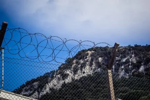 Close-up of security razor wire and barbed wire fence at historic military .. Stock Photos