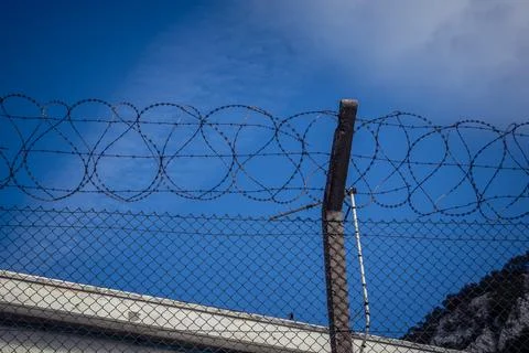 Close-up of security razor wire and barbed wire fence at historic military .. Stock Photos