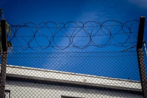 Close-up of security razor wire and barbed wire fence at historic military .. Stock Photos
