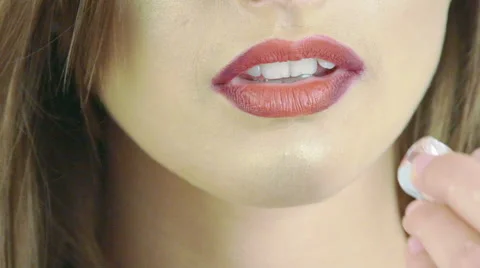 Close up of seductive girl touching her claret lips with ice cube. Slowly Stock Footage 65241934