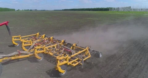 Close-up of a seeder with a plow working in the field. Sowing. Stock Footage 160547431