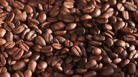 Close up of seeds of coffee. Fragrant coffee beans are rotate Stock Footage 167790141