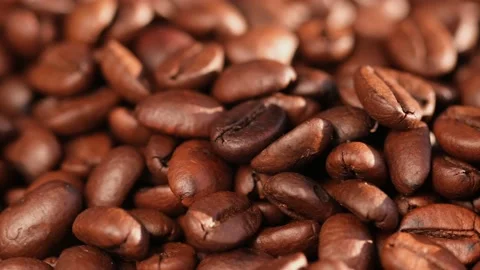 Close up of seeds of coffee. Fragrant coffee beans are rotate Stock Footage 167795125