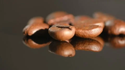 Close up of seeds of coffee. Fragrant coffee beans are roasted smoke comes from Stock Footage 234166937