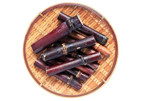 Close up of Segment sugar cane or Saccharum officinarum on bamboo colander  Stock Photos