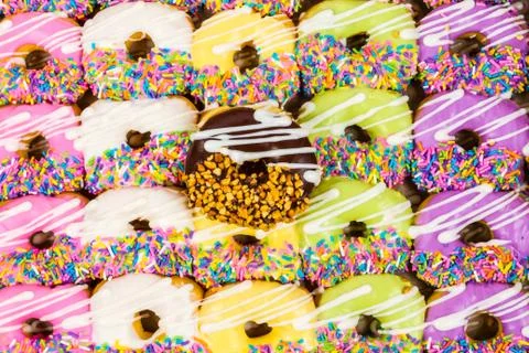Close up of a selection of colorful donuts. Stock Photos