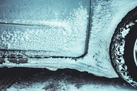 Close up of selective focus of car wheel over the snow in Norway Stock Photos