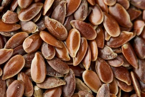 Close-up selective focus healthy flax seed background, macro. Stock Photos