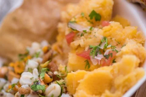 Close up of selective focus of homemade mashed potatoes with salad, tostado and Stock Photos
