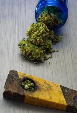 Close up selective focus on marijuana and pipe background Stock Photos