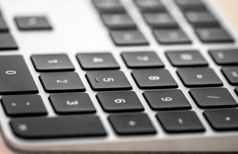 Close up selective focus shot of a black wireless computer keyboard Stock Photos