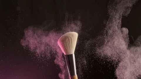 Close up selective focus shot of shimmer powder being shaken off makeup brush Stock-Footage 194395275