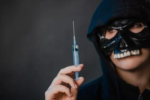 Close-up, selective focus on a syringe in the hands of a person Stock Photos