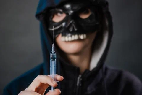 Close-up, selective focus on a syringe in the hands of a person Stock Photos