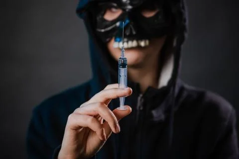 Close-up, selective focus on a syringe in the hands of a person Stock Photos