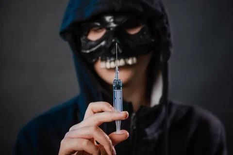 Close-up, selective focus on a syringe in the hands of a person Stock Photos