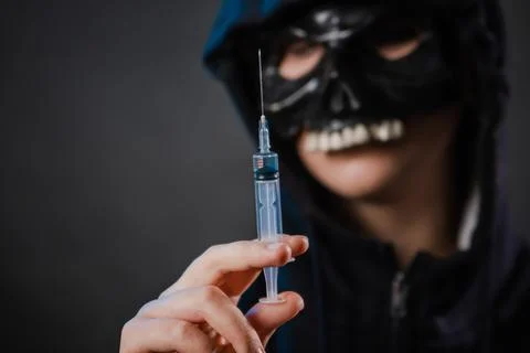 Close-up, selective focus on a syringe in the hands of a person Foto stock