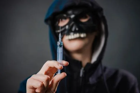 Close-up, selective focus on a syringe in the hands of a person Stock Photos