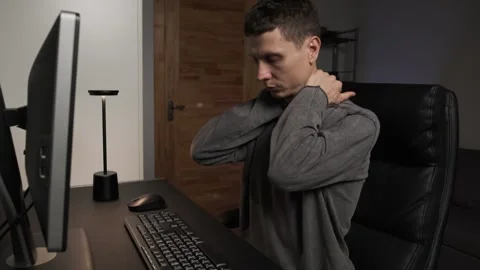 Close up self massage during computer work man massaging face neck shoulders Stock Footage 315412058
